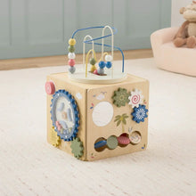 Wooden activity cube with bead track and textured gear and flower panels