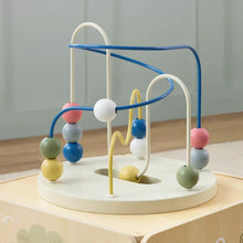 Wooden activity cube with multicolored bead tracks and arched handle frame