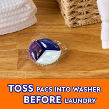 Laundry detergent Power Pac pods, purple and white, wrapped on wooden floor