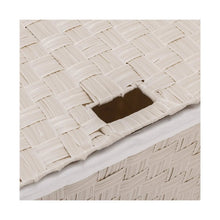 Laundry hamper lid opening with visible woven weave and dark interior opening