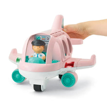 Pink aircraft toy with cabin window and pilot figure, held by a hand