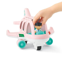 Toy pink plane playset with seated pilot figure and removable access piece