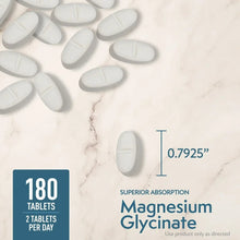 Magnesium glycinate bottle with 180 tablets label and white capsules on marble