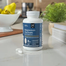 Magnesium glycinate bottle on countertop with cap and front label, 180 tablets