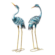 Metal crane statues set of 2, blue and silver cranes with long gold legs.