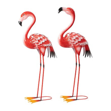 Pair of red metal flamingo statues with long thin legs, feather details, black beaks, bases