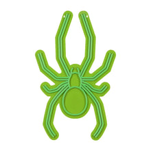 Green neon spider wall decor, front view with hollow circular abdomen