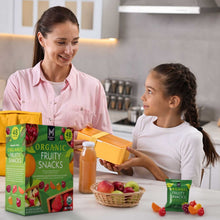 Organic fruity snacks box and pouch held by a child in a kitchen setting