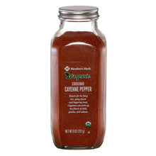 Ground cayenne pepper in glass jar with metal lid, front label visible