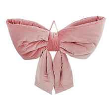 Oversized velvet bow decor in dusty pink with wide bow wings and hanging tails