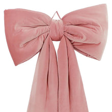 Oversized velvet bow decor with gathered center and long dusty pink ribbon tails