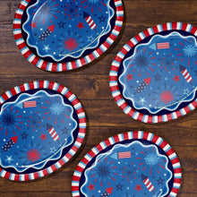 Set of patriotic oval paper plates with blue star-and-fireworks graphics and red striped trim