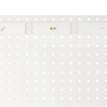 White pegboard organizer board with mounting holes and slots
