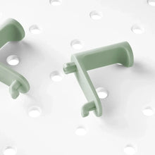 Mint green pegboard hooks set for hanging items on holes