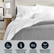 Solid white fitted sheet and pillowcases with matching flat sheet on bed