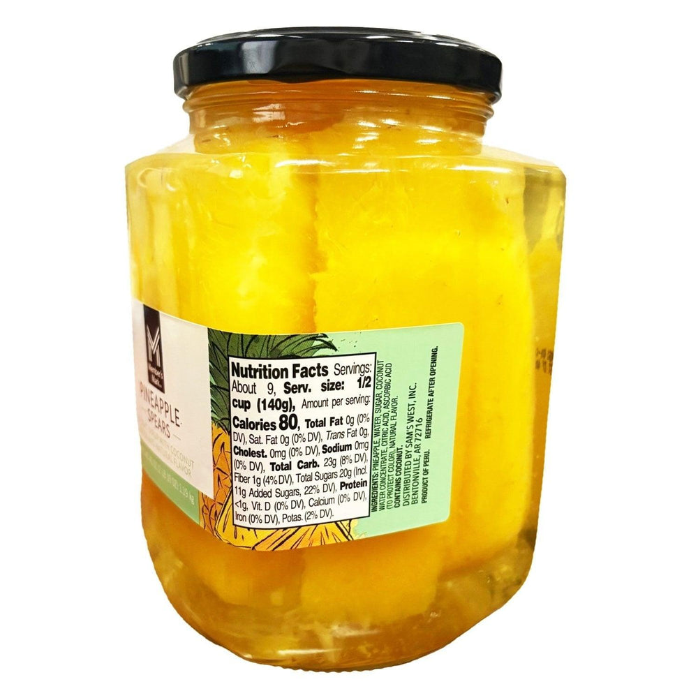 Front label on pineapple spears in coconut water jar with black lid
