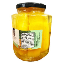 Front label on pineapple spears in coconut water jar with black lid