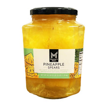 Jar of pineapple spears in coconut water, black lid, yellow pineapple pieces