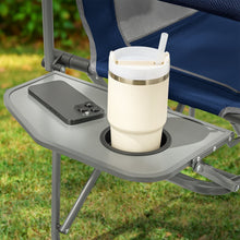 Blue director chair cup holder tray with white drink container on top