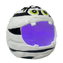Pre-lit ceramic mummy candy bowl with green-eyed face and purple glowing interior