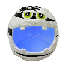 Pre-lit ceramic mummy candy bowl with green-eyed face and blue glowing interior