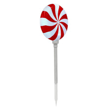Single peppermint lollipop stake light with red-and-white swirl head, unlit stake