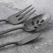 Black 5-piece serving cutlery set, satin finish fork and spoon close-up