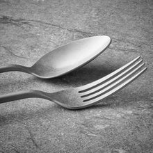 Stainless steel spoon and fork pair with polished handles