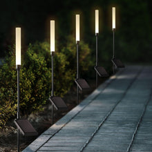 Set of five black LED solar landscape accent lights with glowing frosted tubes and spike stakes