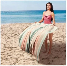 Pastel striped beach towel with mint, pink, and cream vertical stripes, fringe edge