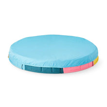 Children's inflatable sandbox with light blue fabric cover and multicolor padded base.
