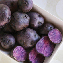 Tray of purple-skinned seed potatoes