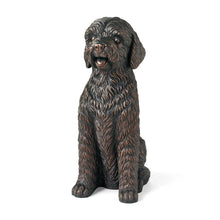 Sitting dog statue with curly fur texture and open mouth, brown/tan