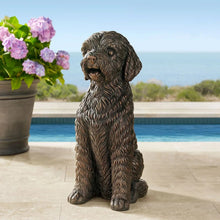 Sitting dog statue with curly fur texture, brown/tan