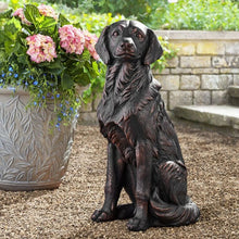 Bronze sitting golden retriever dog statue with detailed face and curled tail