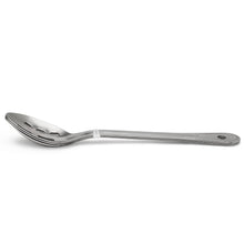 Stainless steel slotted kitchen spoon with round hole in handle