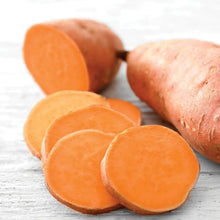 Sliced sweet potatoes with orange rounds and brown outer skin