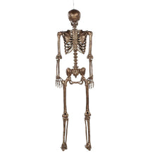 Gold-tone skeleton decoration with glowing red eyes, full body front view with cord