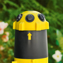 Telescoping tripod sprinkler head in yellow and dark gray with top control dial panels