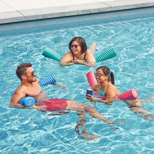 Tri-color ribbed pool noodles floating in pool water