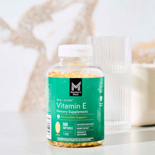 Vitamin E softgels bottle with green label and clear cap