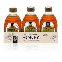 Three wildflower honey bottles with gold caps, 48 oz bottles