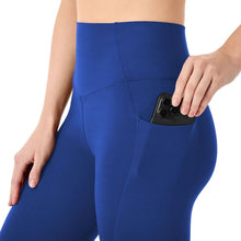 Blue high-rise active leggings with built-in pocket area and contoured seams