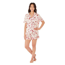 Women’s pajama set: short-sleeve notch-collar top and elastic-waist shorts, red bow print