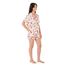 Women’s pajama set in white with red bow-print, short sleeves and elastic-waist shorts