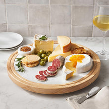 Wood-and-marble lazy susan serving tray with marble center and wood rim, filled with food
