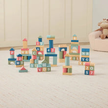 Wooden alphabet building blocks stacked into lettered towers with colorful blocks