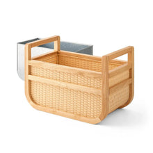 Woven drink cooler with light wood frame, open interior, and metal liner