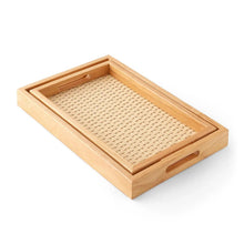 Rectangular wooden serving tray with woven insert and side handles