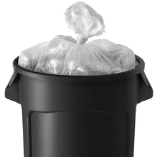 Black trash can with clear plastic liner bag tied at the top